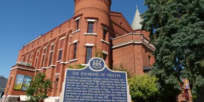 A Provincial Heritage Plaque outside the Orillia Opera House details the city's founding 